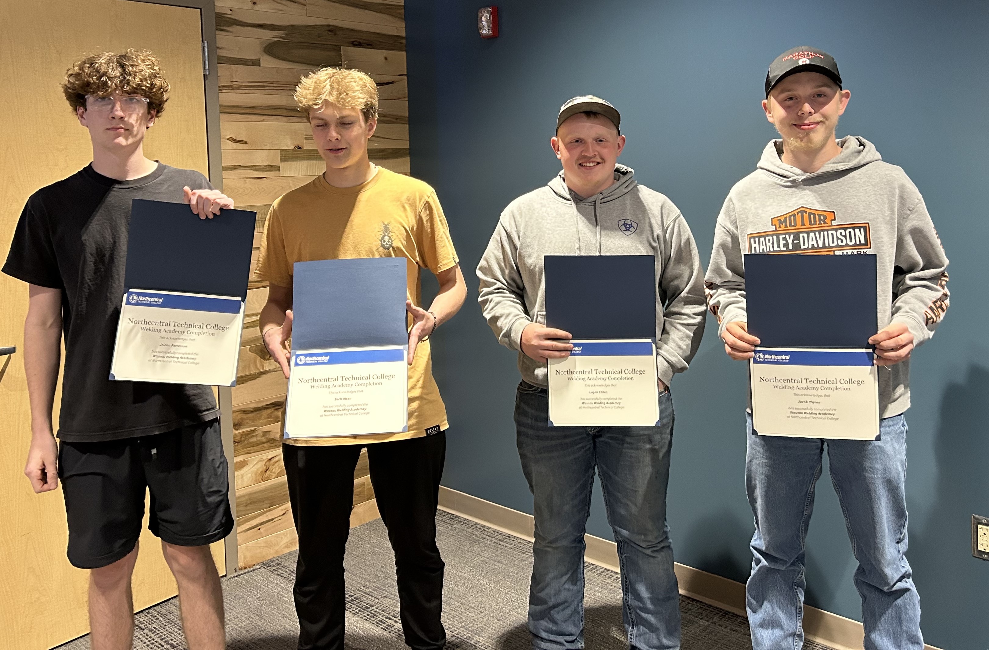 Wausau Welding Academy students posing with their completion certificates.